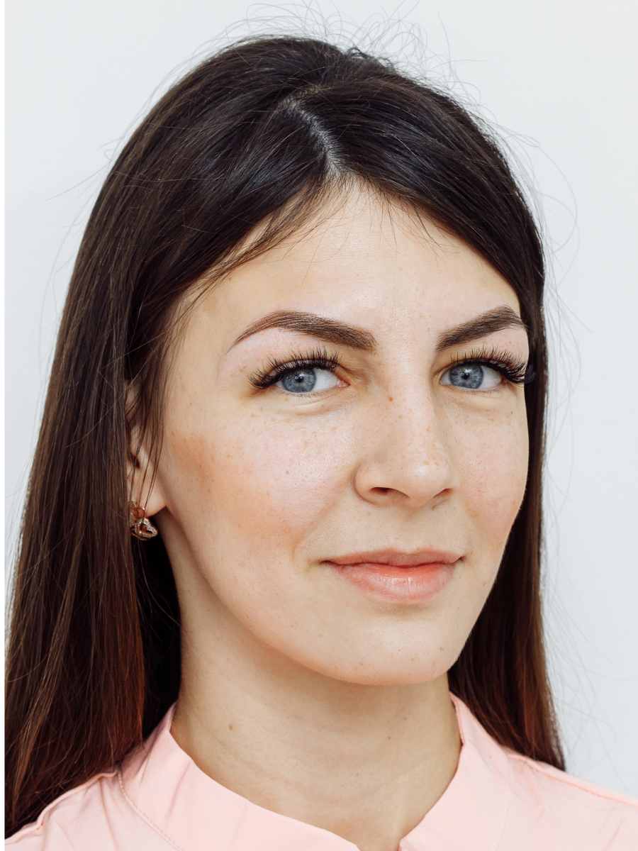Woman with long hair and blue eyes.