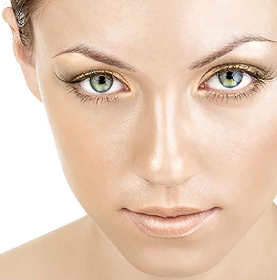 Close-up of woman with green eyes.