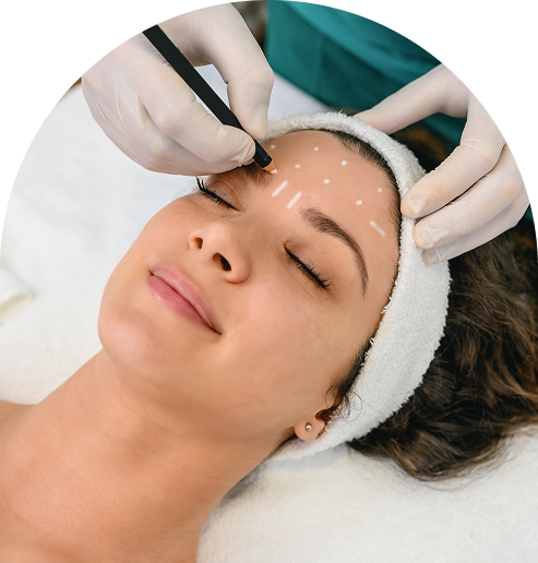 Woman receiving forehead cosmetic injections