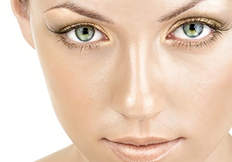 Close-up of woman with green eyes.
